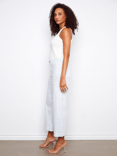 Chic flare fit striped pants designed with functional back pockets and crafted from stretch twill fabric by Charlie B.