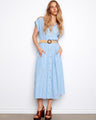 Blue striped dress featuring a shirt collar and straw waist belt, adding a classic touch to your wardrobe. By Charlie B.