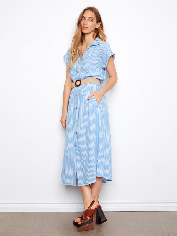 Embrace comfort and style with this blue dress featuring short dolman sleeves. Fashioned by Charlie B.