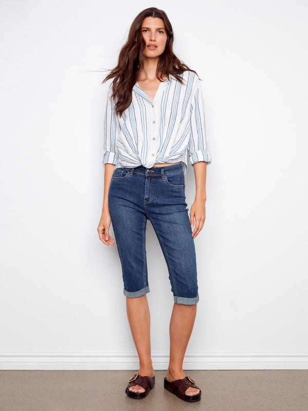 Roll-up sleeves provide a laid-back look that's both functional and fashionable. By Charlie B.