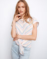 Striped top featuring a boat neckline, perfect for casual outings. The soft colors add a touch of elegance to any ensemble by Charlie B.
