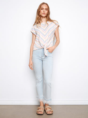 Chic striped top with a front hem tie, adding a playful element to your everyday look. Ideal for pairing with jeans by Charlie B.