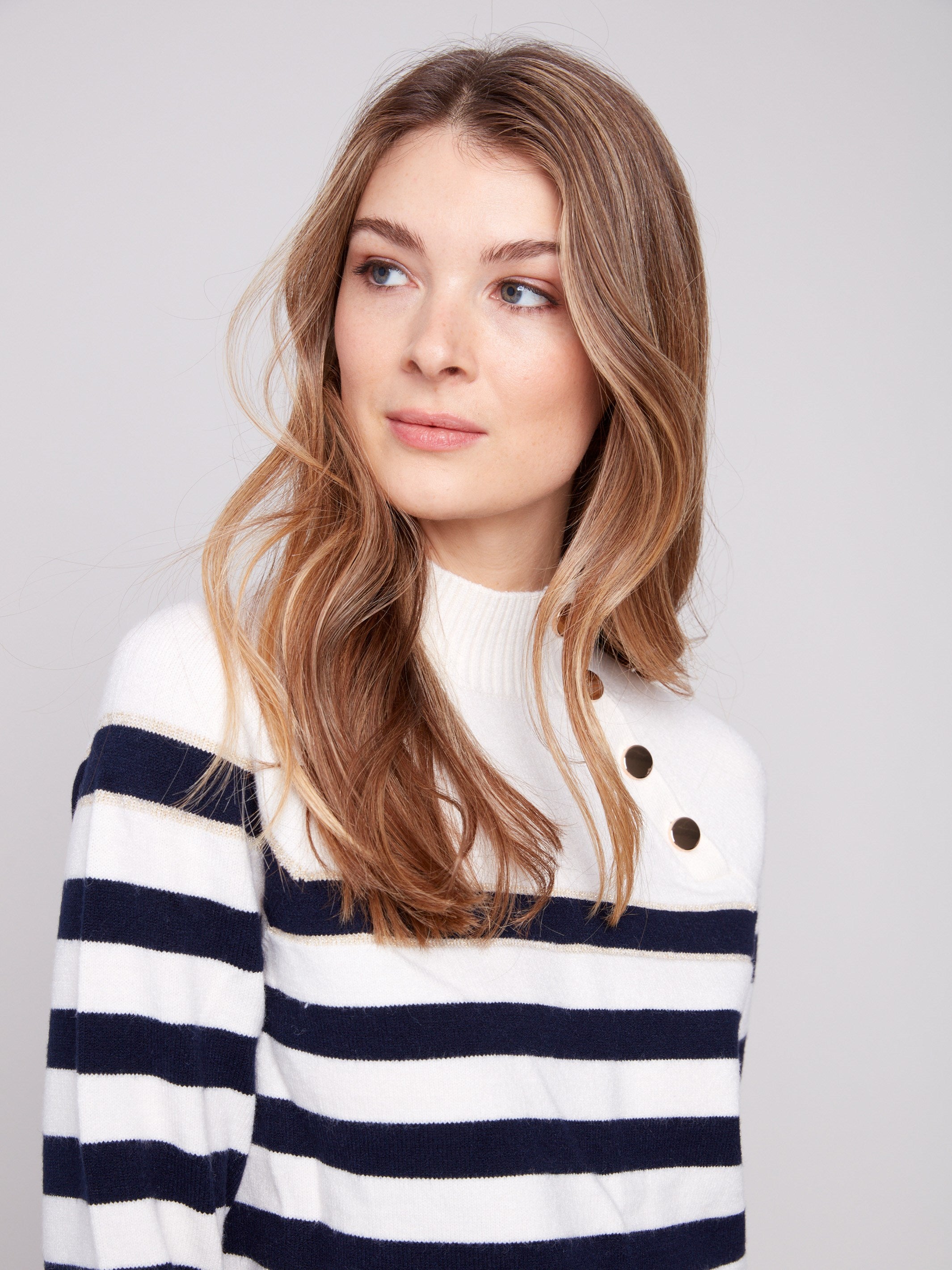 Subtle gold detail on this striped sweater adds an element of sophistication and style by Charlie B.
