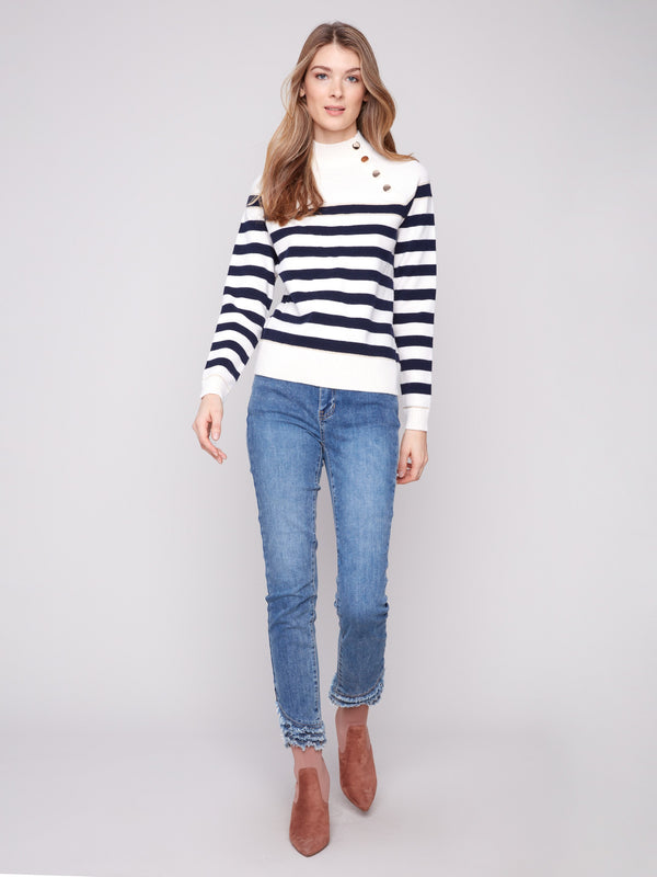 The mock neck design elevates this offwhite striped sweater with a modern twist by Charlie B.
