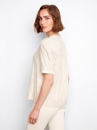 Beige blouse crafted from a cotton blend, showcasing subtle gold stripe accents by Charlie B.