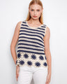 Navy and cream crochet top with a crew neckline, featuring intricate floral hem detailing for a chic look by Charlie B.