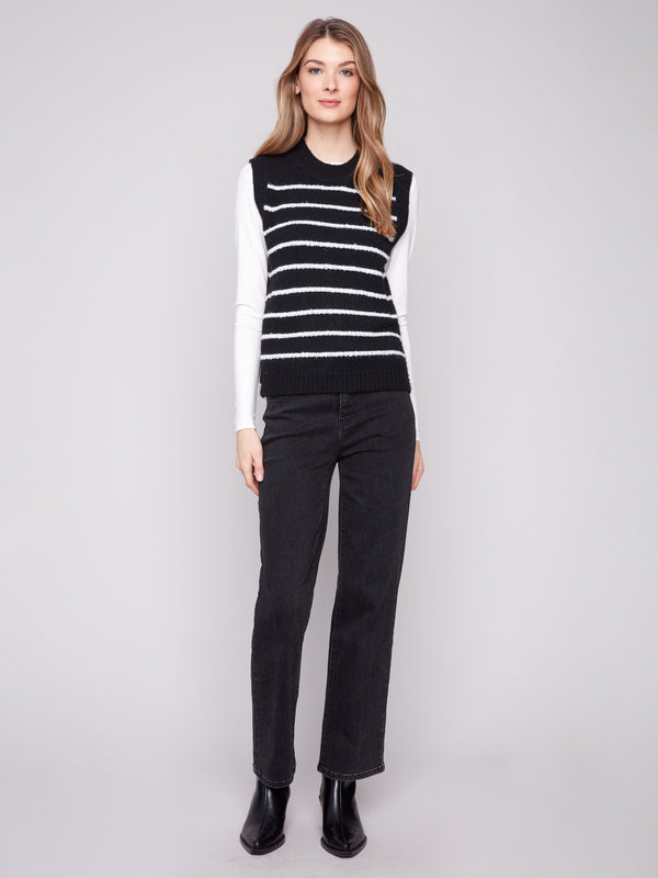 Stylish sleeveless black sweater vest with classic white stripes, perfect for a chic casual look by Charlie B.