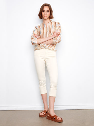 Trendy blouse featuring an eye-catching striped pattern, perfect for adding flair to your wardrobe essentials. By Charlie B.