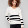 Ecru sweater featuring bold stripes and buttons at the sleeves, adding a chic touch to your wardrobe by Charlie B.