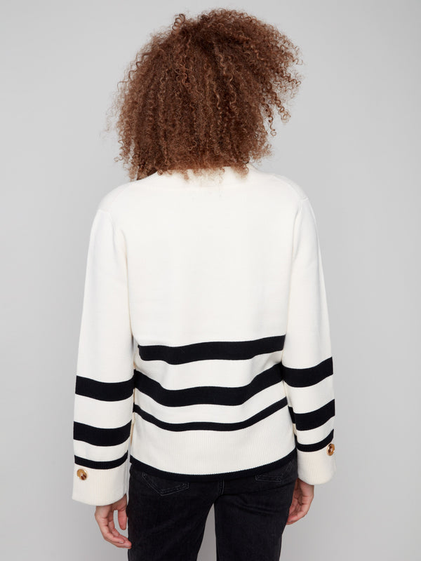 Chic ecru sweater showcasing wide cuffs and stylish buttons for a sophisticated addition to any outfit by Charlie B.