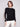 Elegant black sweater featuring crochet sleeves, perfect for a stylish look by Charlie B.