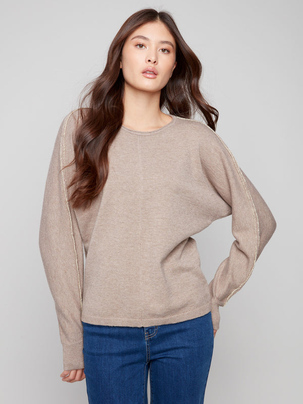 Chic taupe sweater showcasing metallic lurex detail on the sleeves for subtle sparkle by Charlie B.