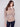 Sweater in fog color, showcasing its removable scarf for versatile styling options by Charlie B.