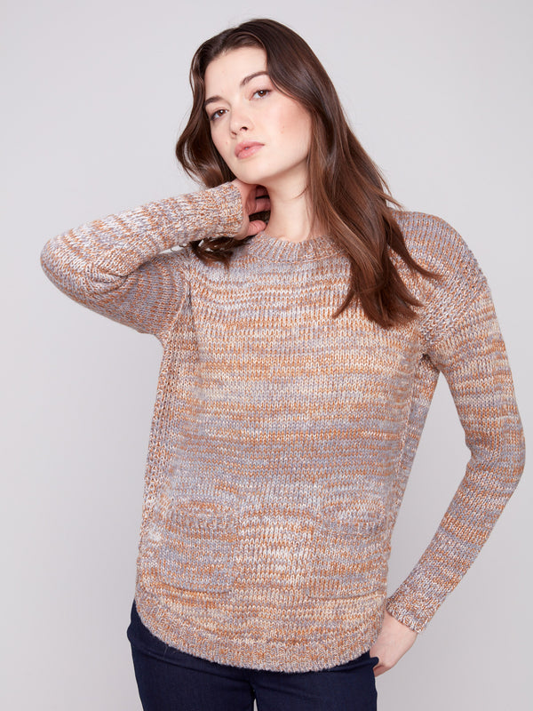 Stylish sweater in fog color with front pockets, offering both functionality and fashion by Charlie B.
