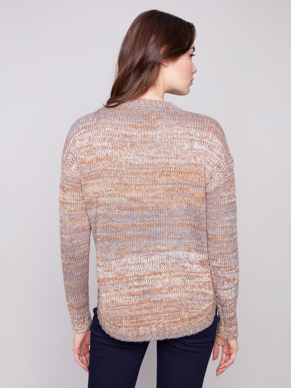 Elegant fog-toned sweater highlighting its unique round hem for added flair by Charlie B.