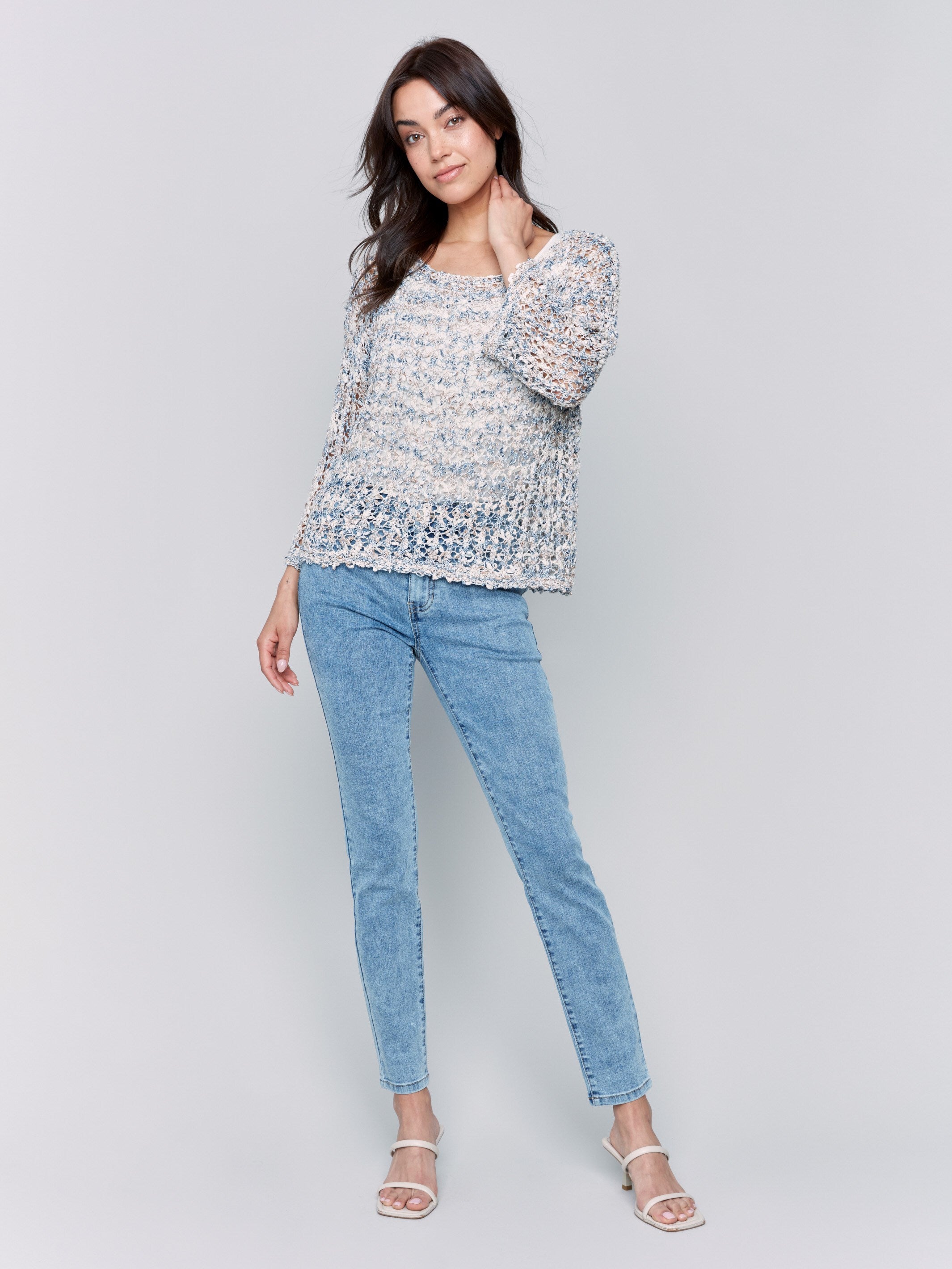 Crew neck denim sweater showcasing relaxed fit by Charlie B.