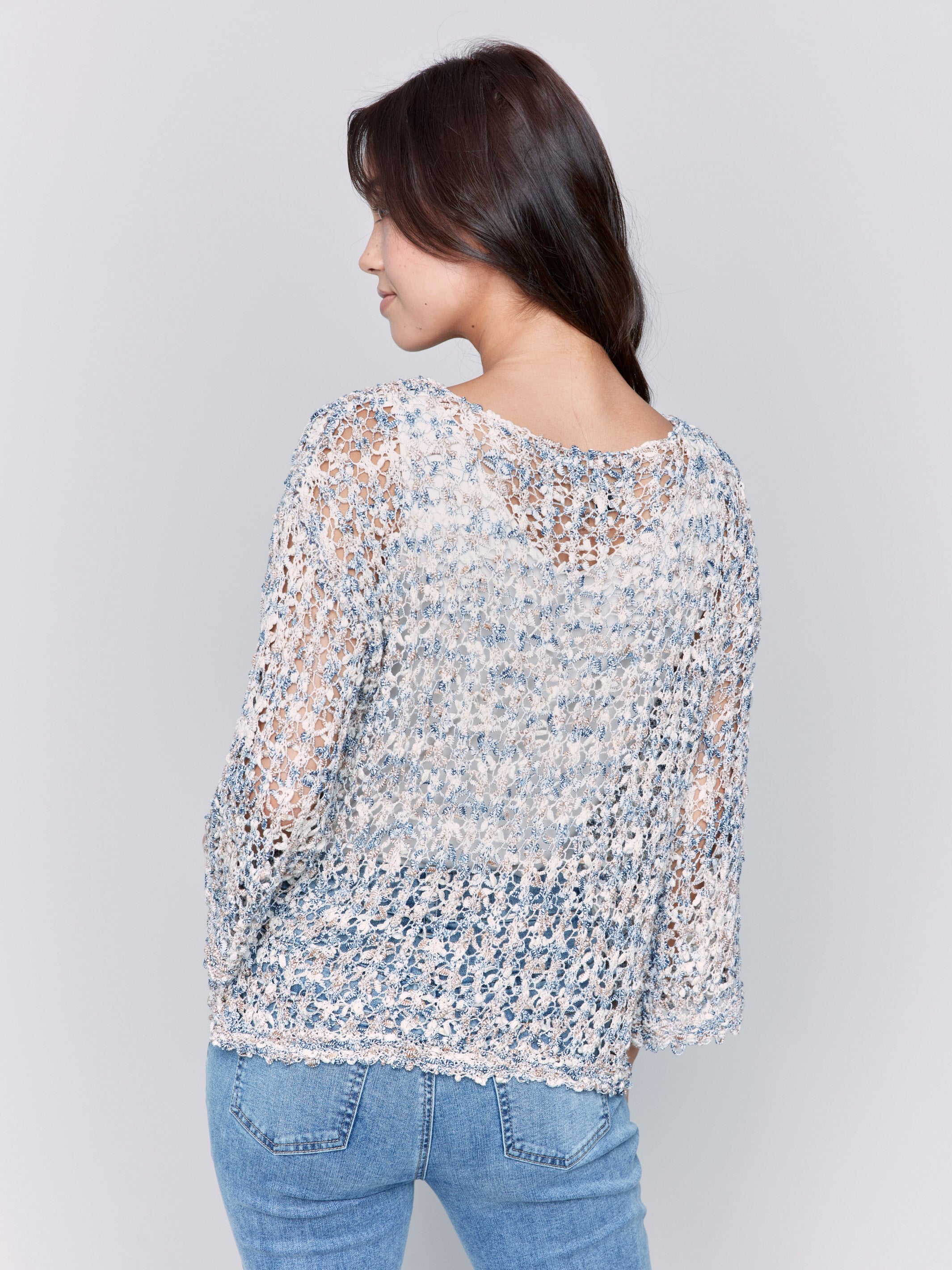 Stylish long sleeves on this denim open-knit sweater by Charlie B.