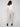 Greige slim-leg techno pants with adjustable waistband, side pockets, and drawcords by Charlie B.