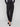 Designed with side zip pockets, these black slim-leg pants add functionality to your everyday attire by Charlie B.