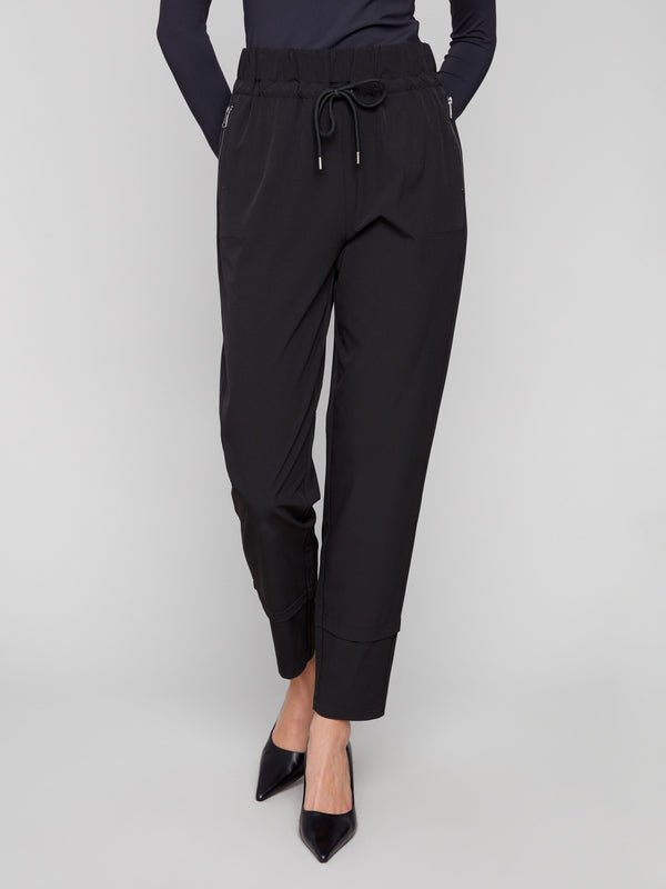 Designed with side zip pockets, these black slim-leg pants add functionality to your everyday attire by Charlie B.