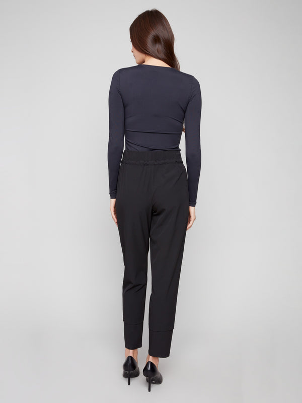 Enjoy the relaxed fit of these stylish black slim-leg pants for a chic yet comfortable look by Charlie B.