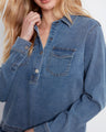 Adjustable button cuffs enhance the fit of this chic denim shirt, making it both practical and stylish. Crafted in stretch Tencel fabric by Charlie B.