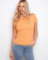 Orange top with a classic crew neck design, offering a timeless style perfect for any casual occasion. By Charlie B.