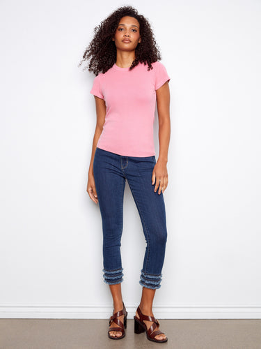 Stylish semi-fitted pink tee with a crew neckline, offering comfort and elegance. By Charlie B.