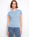 This blue top features a classic crew neck design, offering a timeless look for any wardrobe. By Charlie B.