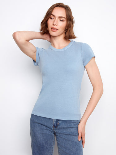 The ribbed texture of this blue top adds a subtle yet stylish detail, perfect for casual wear. By Charlie B.