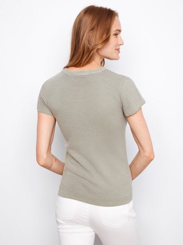 A timeless crew neck style is highlighted in this piece, ensuring it pairs well with various outfits effortlessly by Charlie B.
