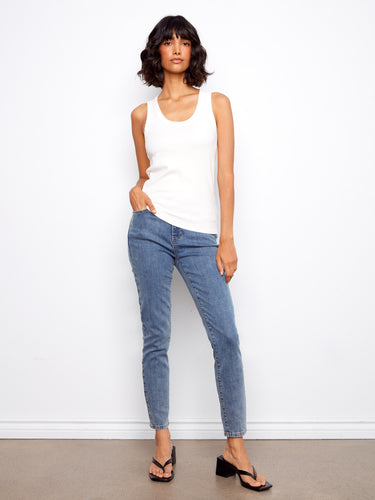 Simple yet stylish ribbed texture on this white tank makes it an essential addition to your wardrobe basics. By Charlie B.