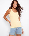 Yellow tank top featuring a scoop neckline, paired with denim shorts. The ribbed texture adds a stylish touch by Charlie B.