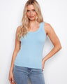 Light blue tank top featuring a scoop neckline, perfect for casual wear. Designed with comfort in mind by Charlie B.
