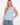Light blue tank top featuring a scoop neckline, perfect for casual wear. Designed with comfort in mind by Charlie B.