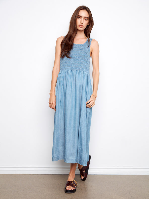 Blue Tencel maxi dress with a smocked bodice and convenient side pockets, ideal for casual outings by Charlie B.
