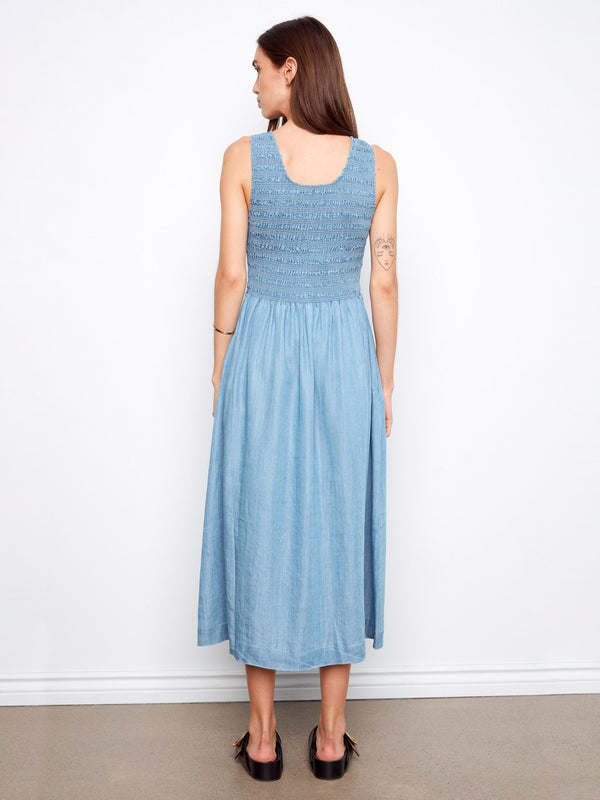 Elegant blue maxi dress crafted from Tencel with a stylish smocked bodice and flowing design by Charlie B.