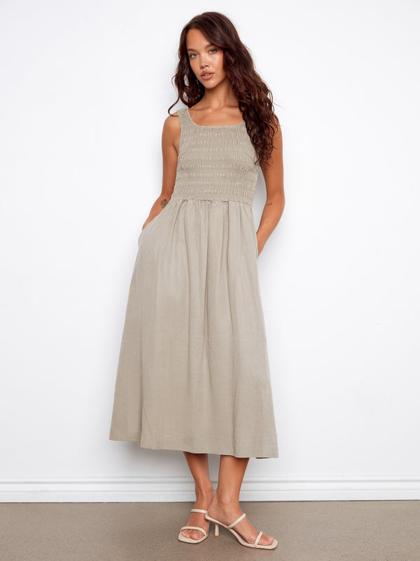 Elegant dress featuring a maxi length with a flowing silhouette, perfect for any occasion. By Charlie B.
