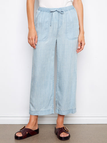 These light blue joggers have an elastic waistband and slash pockets, combining style with functionality by Charlie B.