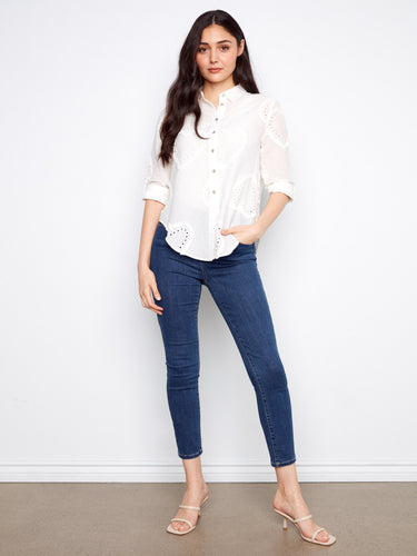 Adorned with eyelet details, this shirt offers a subtle yet stylish texture that elevates your ensemble by Charlie B.