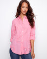 Pink blouse with button-down design, featuring textured cotton and eyelet details by Charlie B.