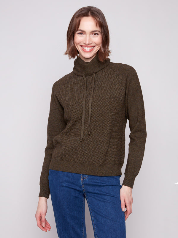 Spruce knit sweater featuring a cozy cowl neck with drawstring detail, perfect for layering by Charlie B.