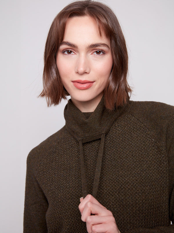 Raglan sleeves enhance the relaxed fit of this chic heather spruce knit sweater by Charlie B.