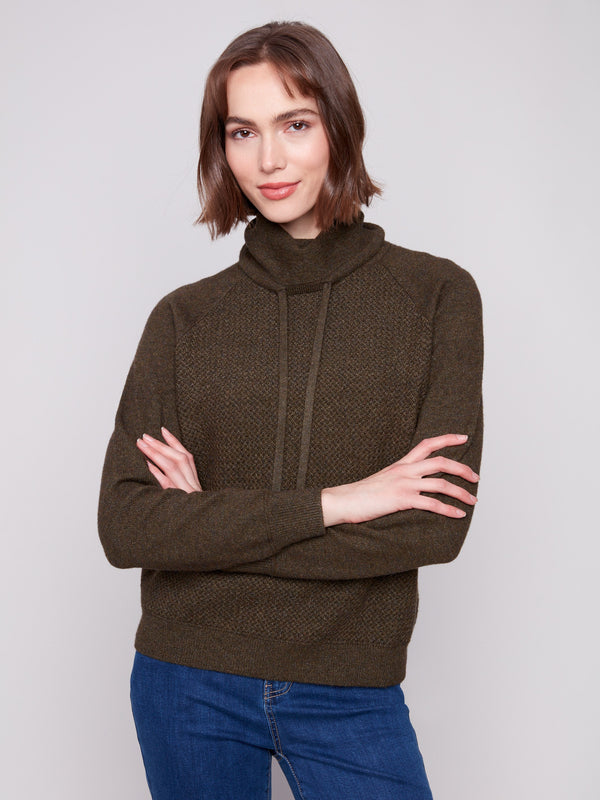 Heathered texture and raglan sleeves create a timeless look in this stylish knit sweater by Charlie B.