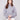 Heather grey knit sweater featuring a stylish cowl neck with drawstring detail for added flair by Charlie B.