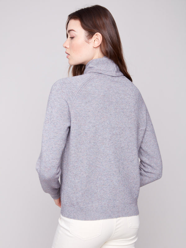 Beautifully crafted heather grey knit with unique raglan sleeves, offering both style and warmth by Charlie B.