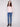 Textured ballet pink sweater offering a stylish slim fit, matched with classic blue jeans by Charlie B.