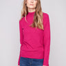 Hibiscus sweater featuring a slim fit, paired with blue jeans for a chic look by Charlie B.