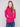 Textured hibiscus sweater styled elegantly with denim, showcasing its mock neck design by Charlie B.