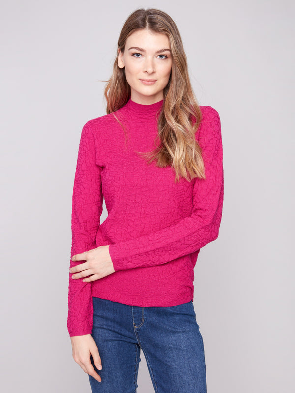 Sophisticated slim-fit hibiscus sweater in textured fabric paired effortlessly with jeans by Charlie B.